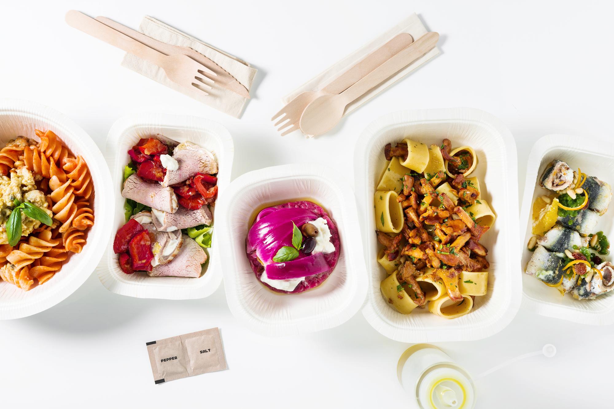 Arrangement of packaged dishes ready for delivery